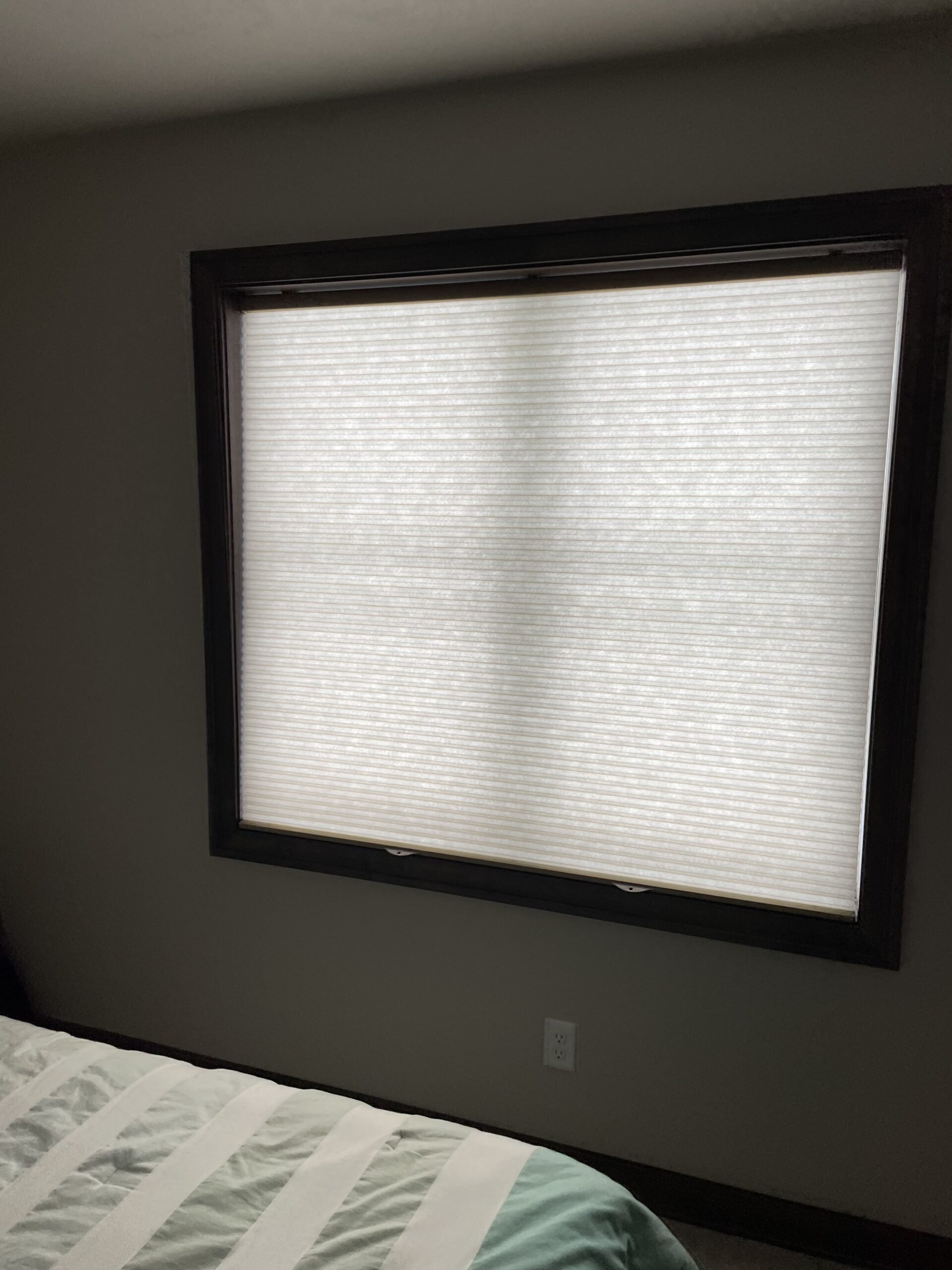 Finished custom blind or shade installation in a comfortable home interior