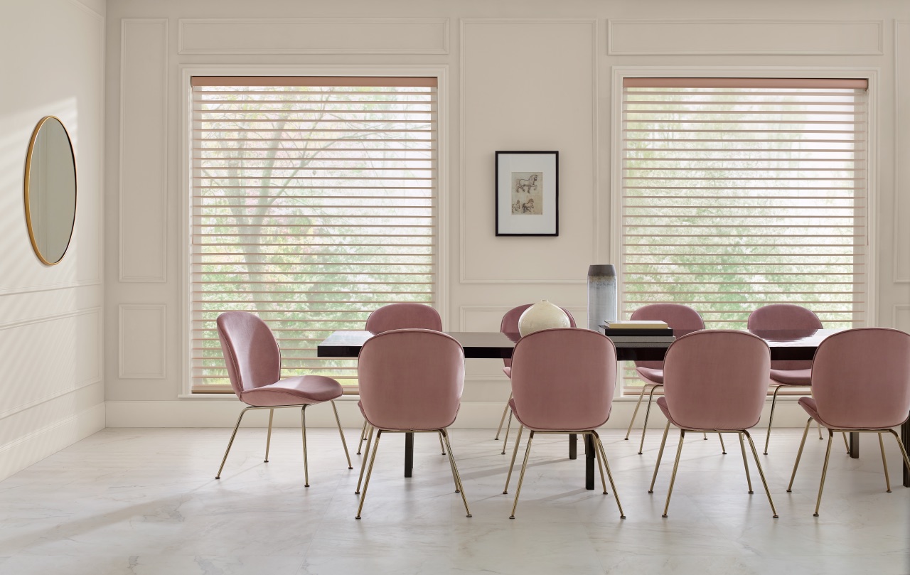 Nantucket™ Window Shadings across a bright dining room with soft blush seating and gently filtered daylight