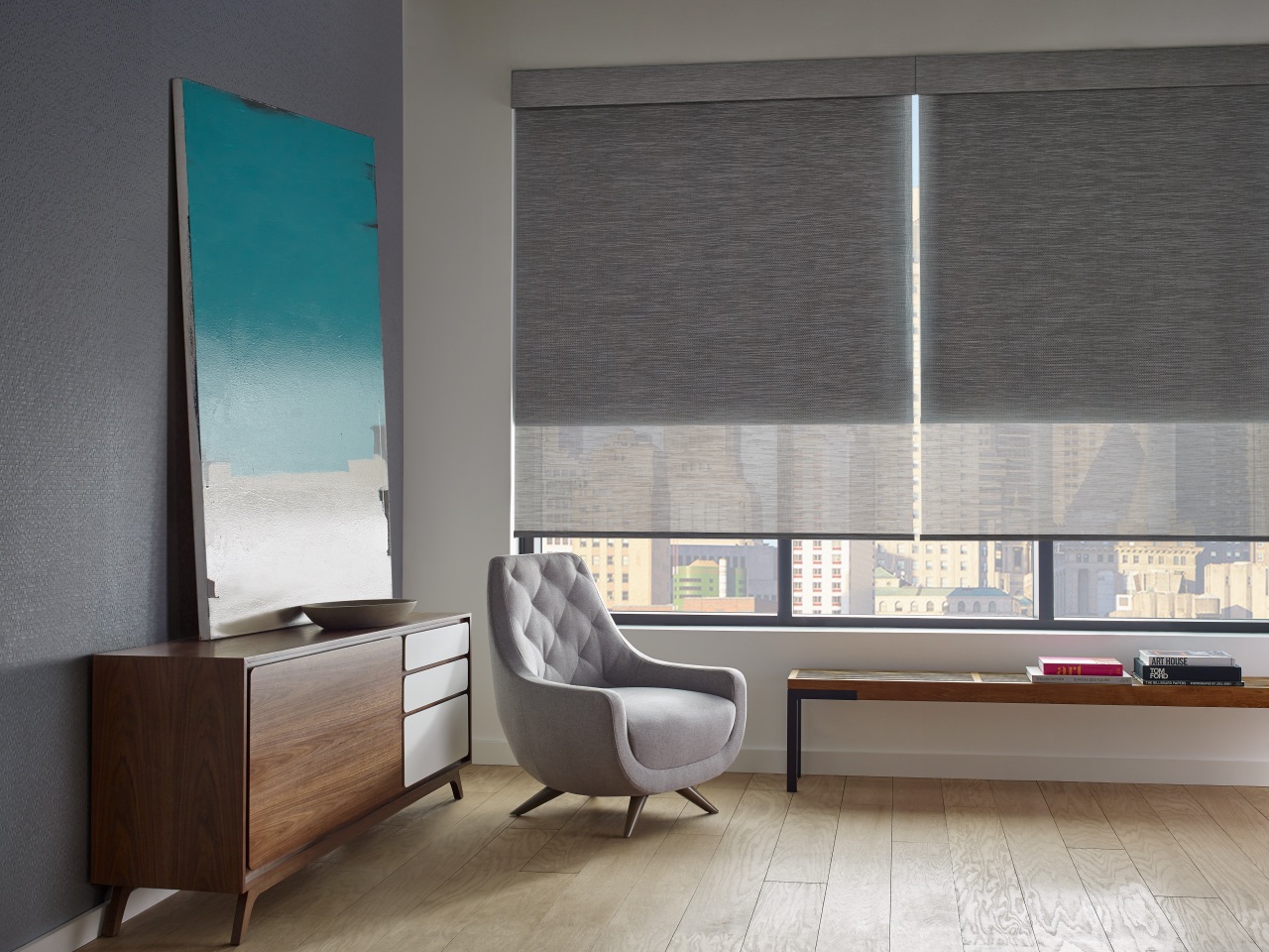 Designer Screen Shades in a bright waterfront room with light-filtering screen fabric and preserved views