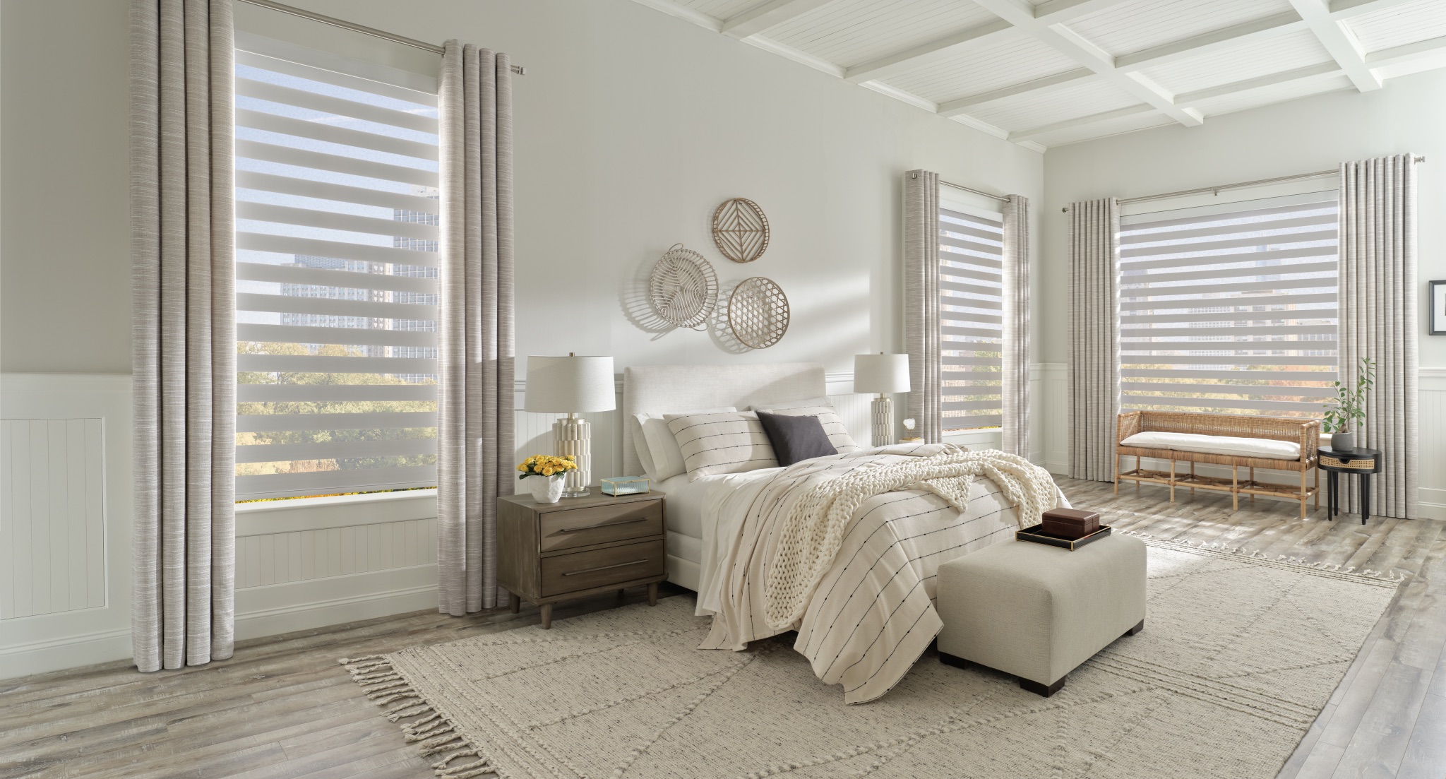 Designer Banded Shades in a bright bedroom with layered fabric bands and soft filtered light